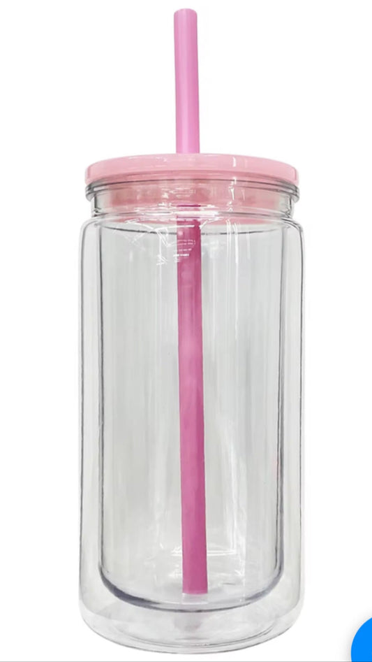 Clear glass jar with pink lid and straw on a white background